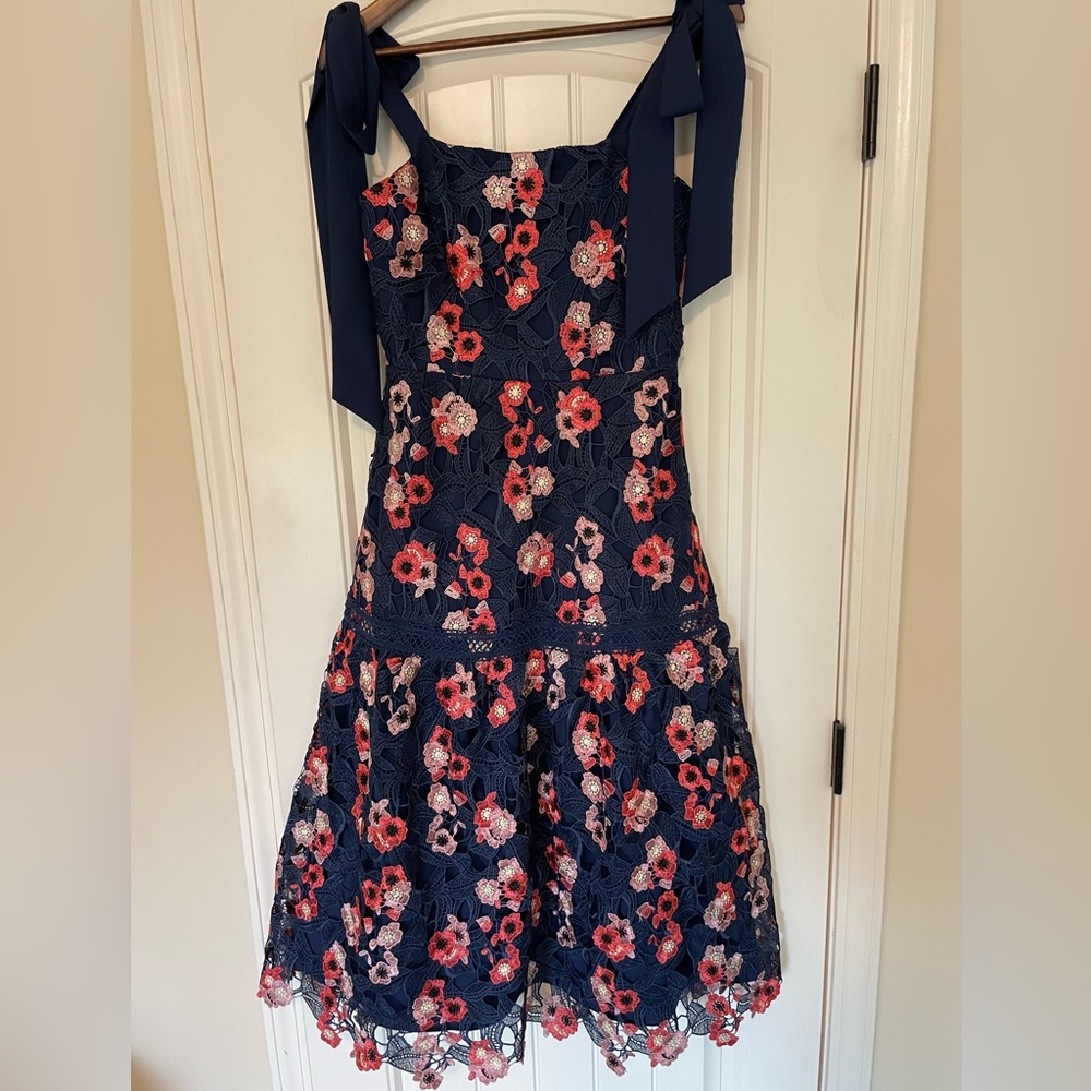 Just Me by Vici dress in navy blue with pink lace flowers in size small.